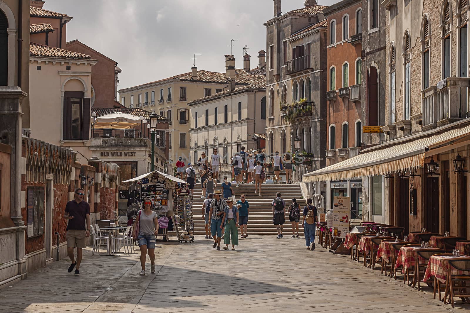 Tourists walk in Venice street 5 by pippocarlot