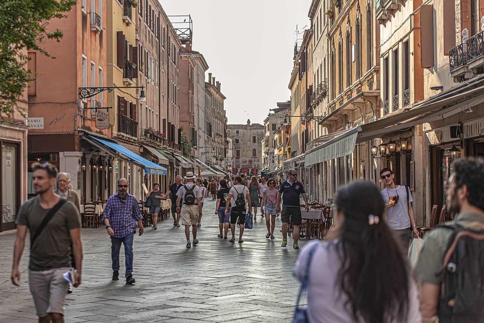 VENICE, ITALY 2 JULY 2020: Tourists walk in Venice street