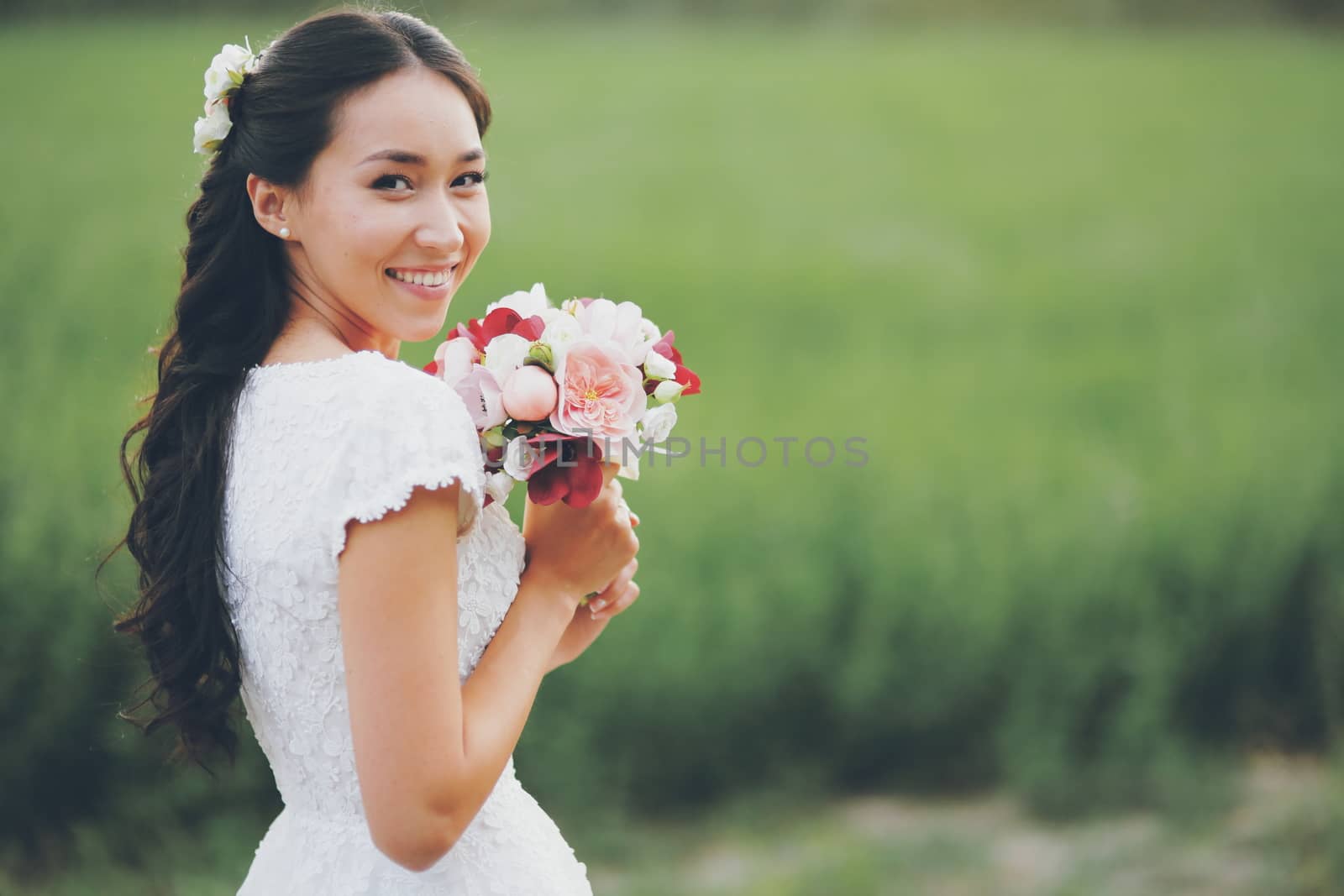Beautiful bride holds a bouquet in her hands. Wedding. Bridal bouquet. Happy love concept. High quality photo
