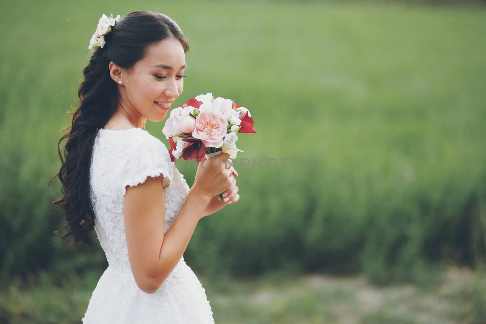 Beautiful bride holds a bouquet in her hands. Wedding. Bridal bouquet. Happy love concept. High quality photo