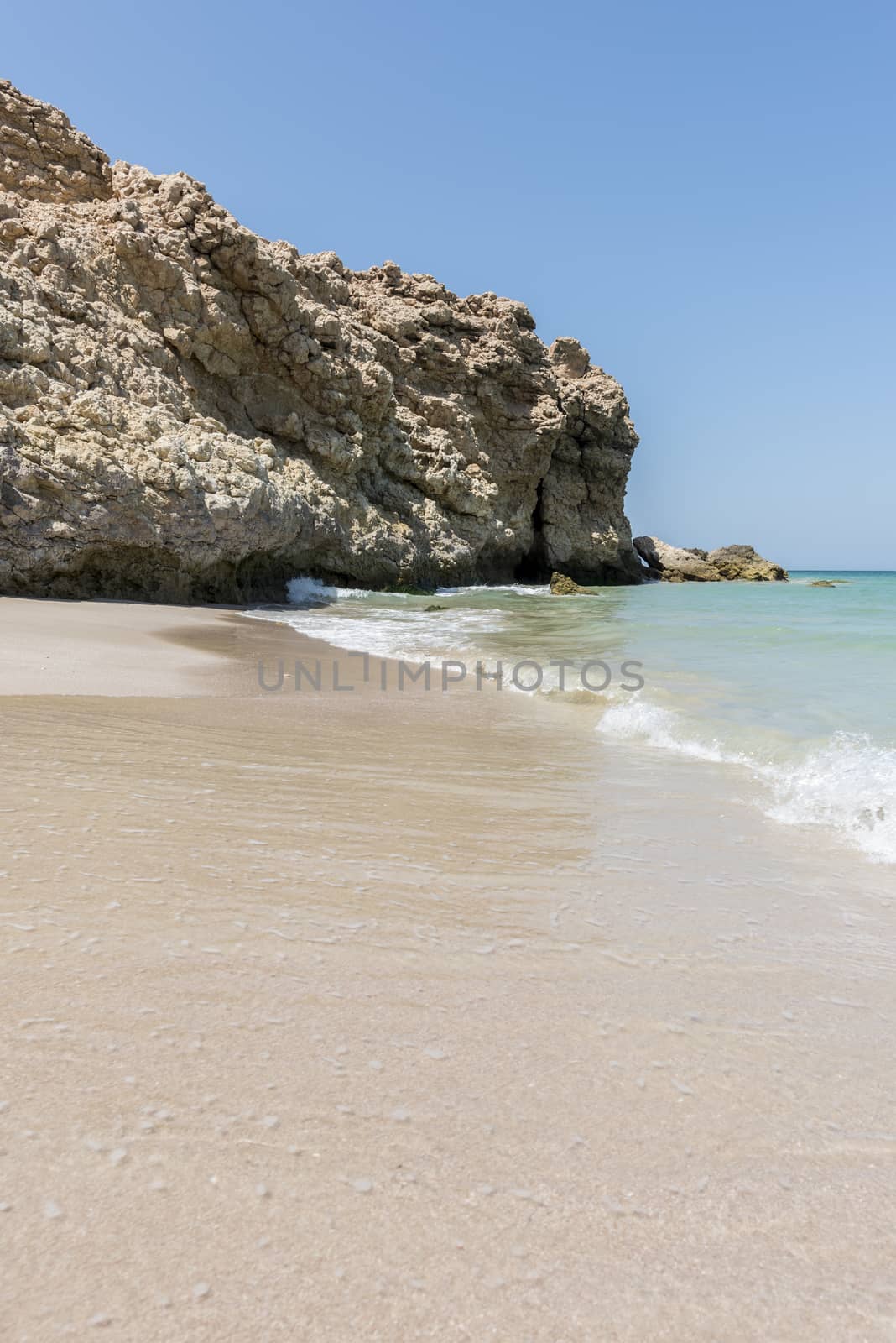 Wild beach at the coat of Ras Al Jinz, Sultanate of Oman. It is close to Ras Al Hadd and many turtles are coming in the region to nest