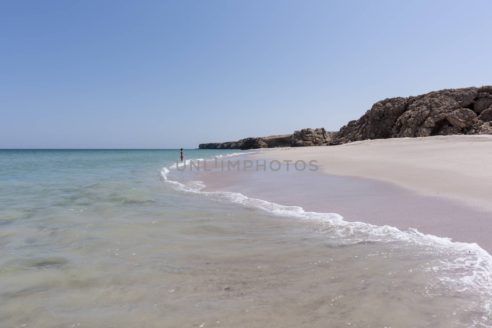 Woman alone at a wild Beach of Ras Al Jinz, Oman by GABIS