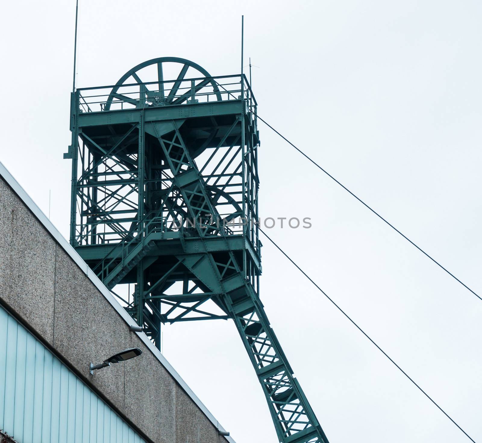 Mining tower of the "Asse" mine, a research mine for radioactive waste near Wolfenbuettel in Lower Saxony Germany, grey sky