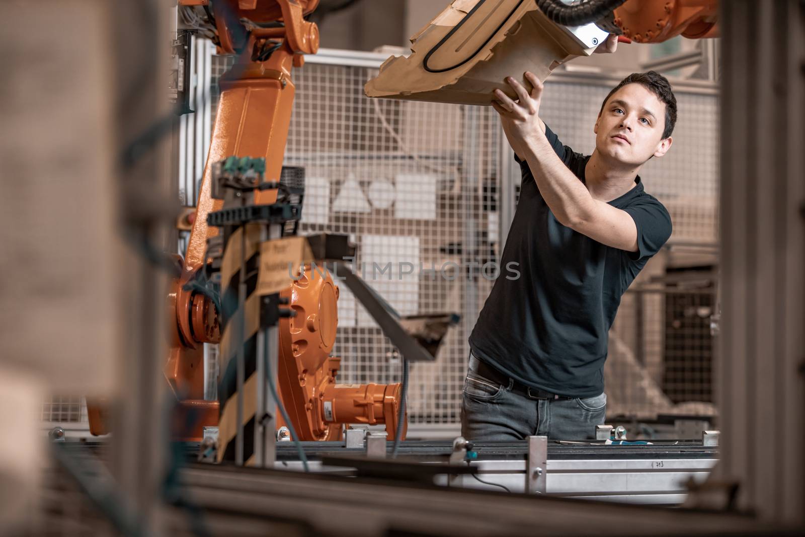 installation of new robot arms in the factory for modernization of production.