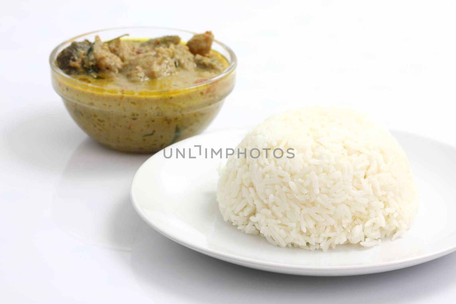 Thai food beef green curry with rice isolated in white backgroun by piyato