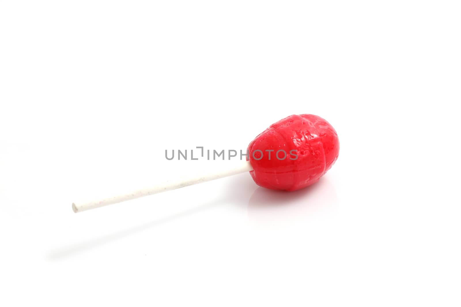 Red candy isolated in white background by piyato