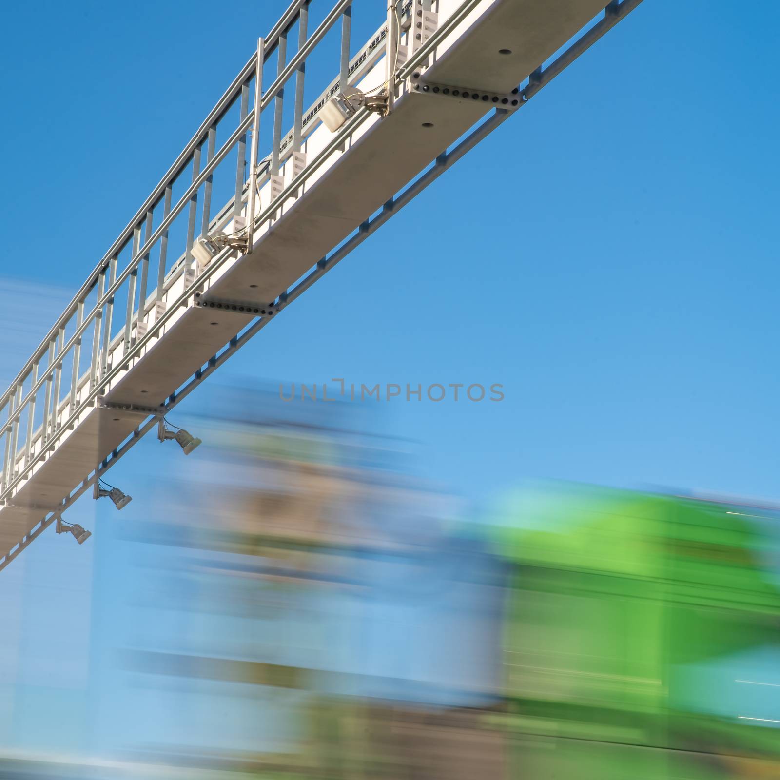 truck drive through the highway through the toll gate, toll charges, blurred motion in the image by Edophoto