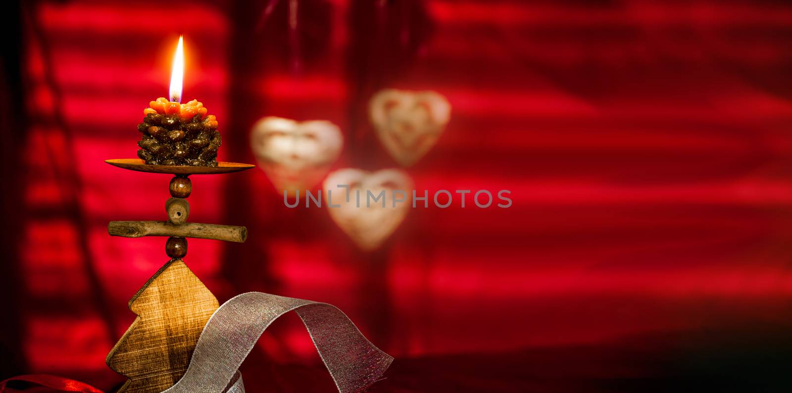 Christmas concept with red background and candles