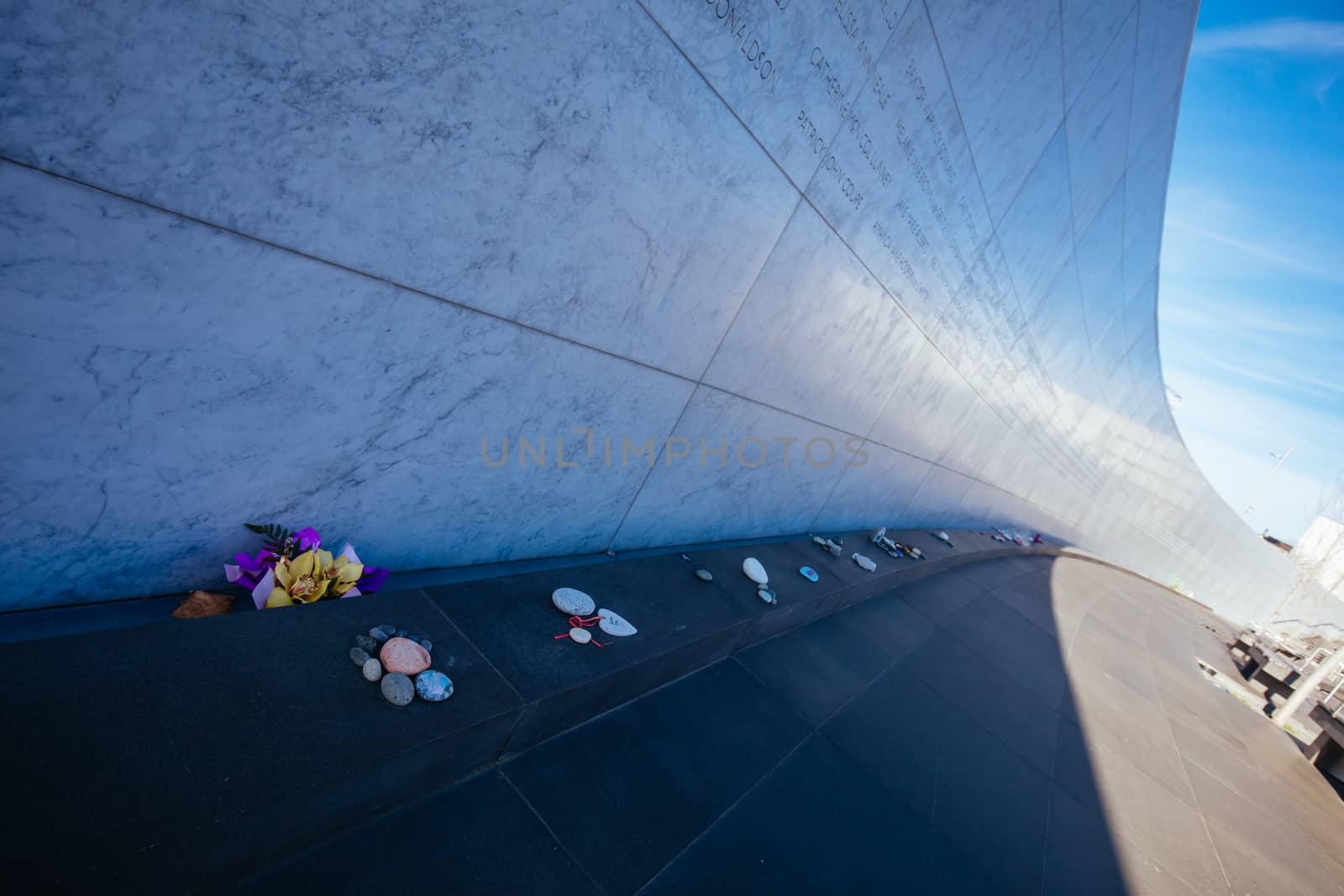 Christchurch, New Zealand - September 18, 2019: Canterbury Earthquake Memorial Wall on the banks of the Avon River with names of 185 lost lives