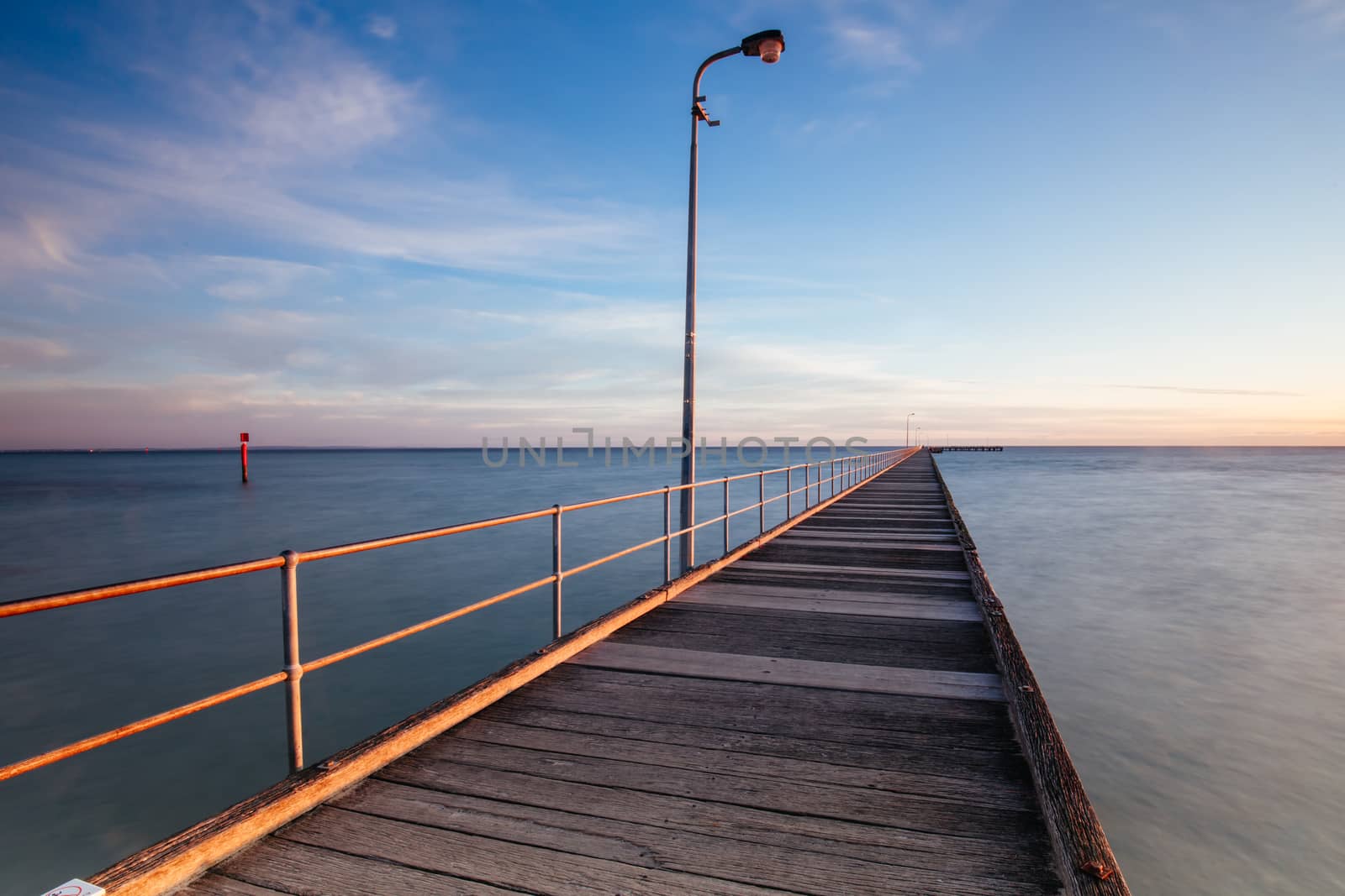 The iconic Rye Pier on a cool winter's morning at sunrise on the Mornington Peninsula in Melbourne, Victoria, Australia