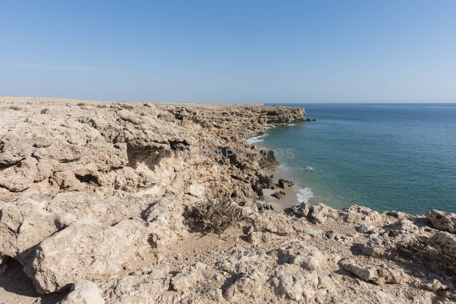 Top view from cliff of a wild beach at the coat of Ras Al Jinz, Sultanate of Oman.