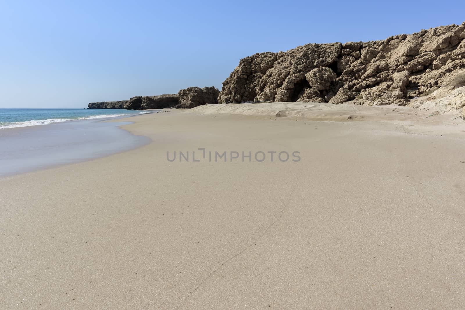 Wild beach at the coat of Ras Al Jinz, Sultanate of Oman. It is close to Ras Al Hadd and turtles are coming in the region to nest attracting many tourists