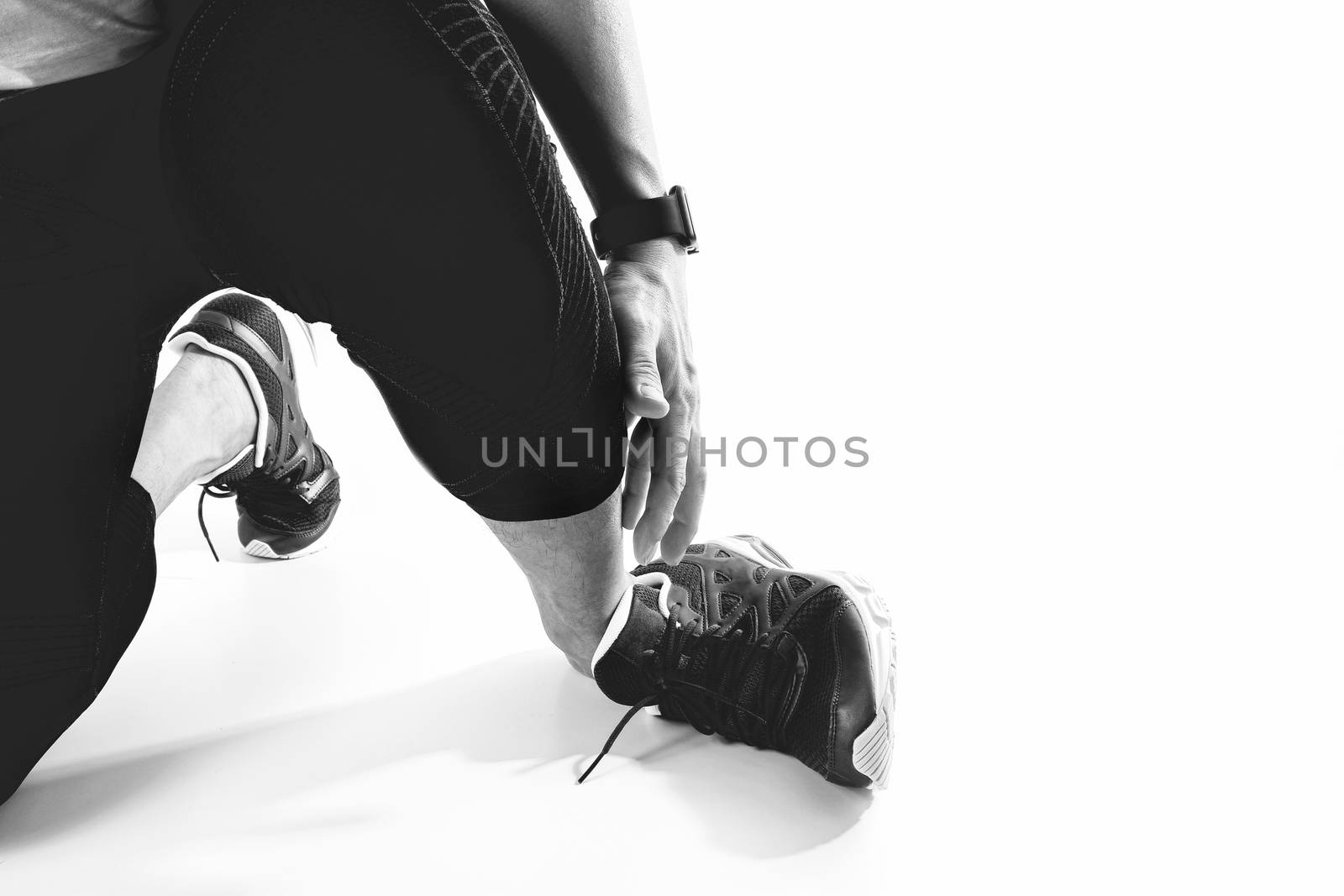 Runner sportsman holding ankle in pain with Broken twisted joint running sport injury and Athletic man touching foot due to sprain on white background