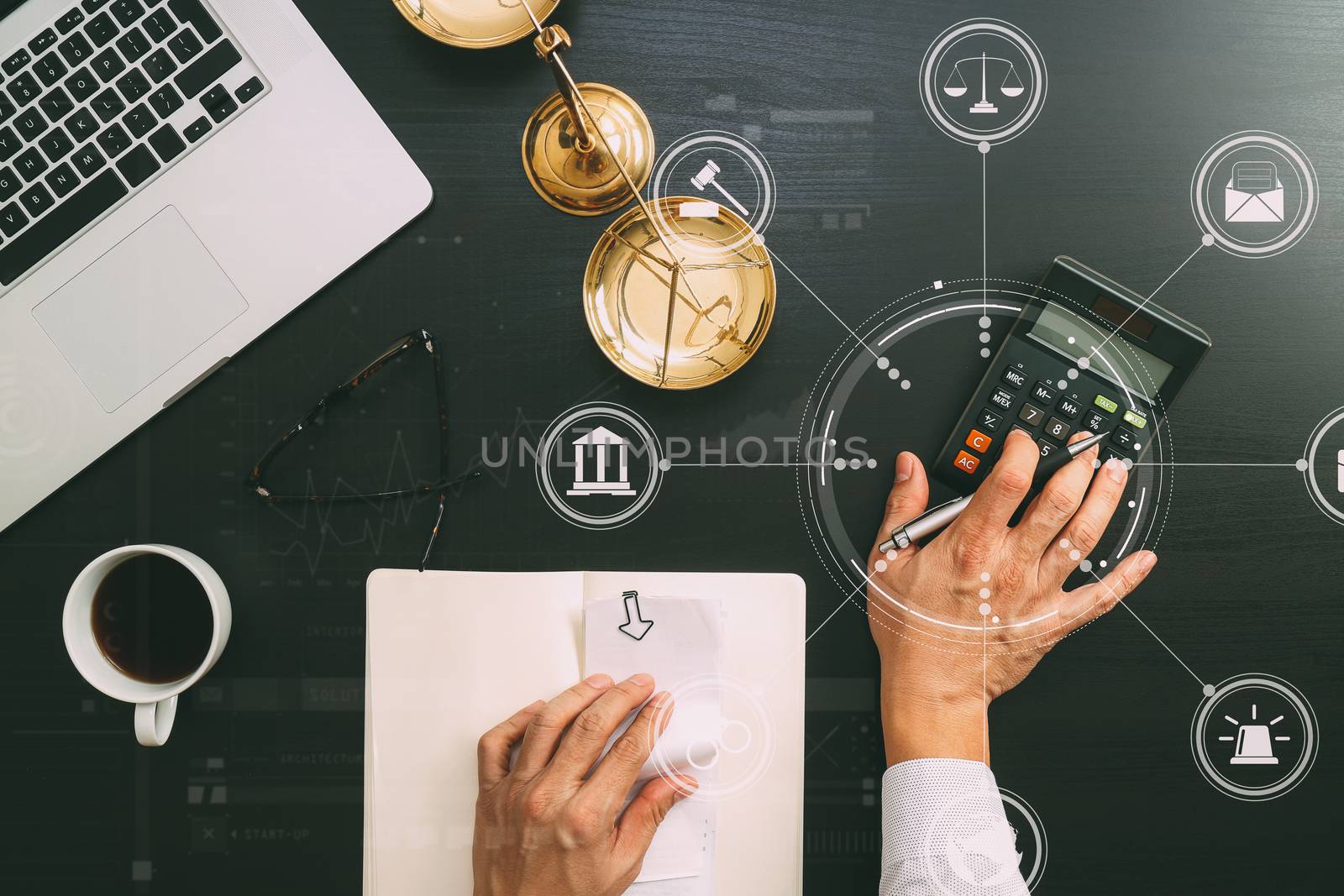 justice and law concept.businessman or lawyer or accountant working on accounts using a calculator and laptop computer and documents with Vr diagram