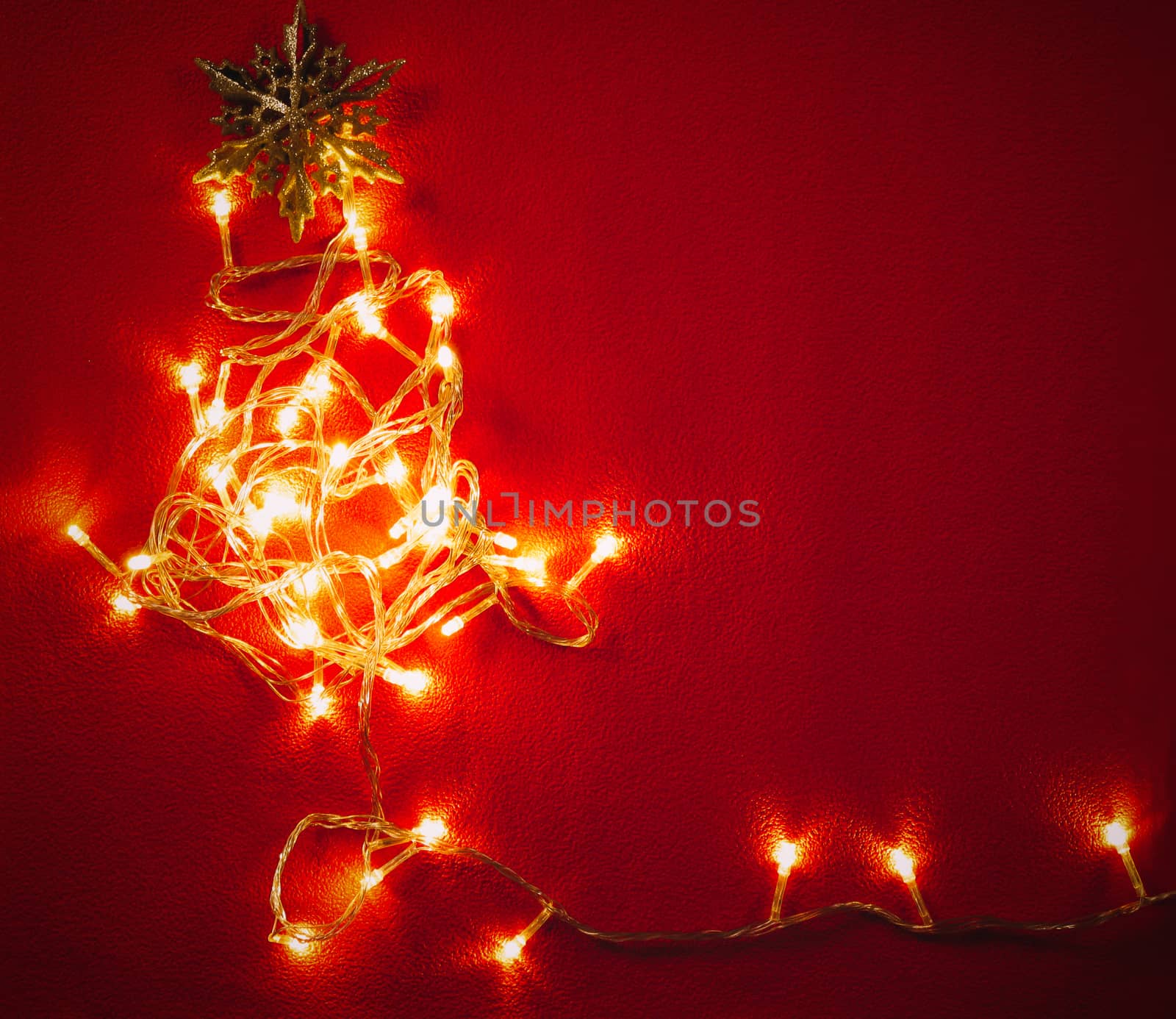 Greeting Season concept.Christmas light and pine star on red and green background
