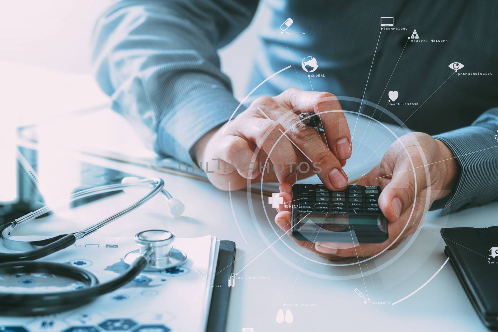 Healthcare costs and fees concept.Hand of smart doctor used a calculator for medical costs in modern hospital with VR icon diagram