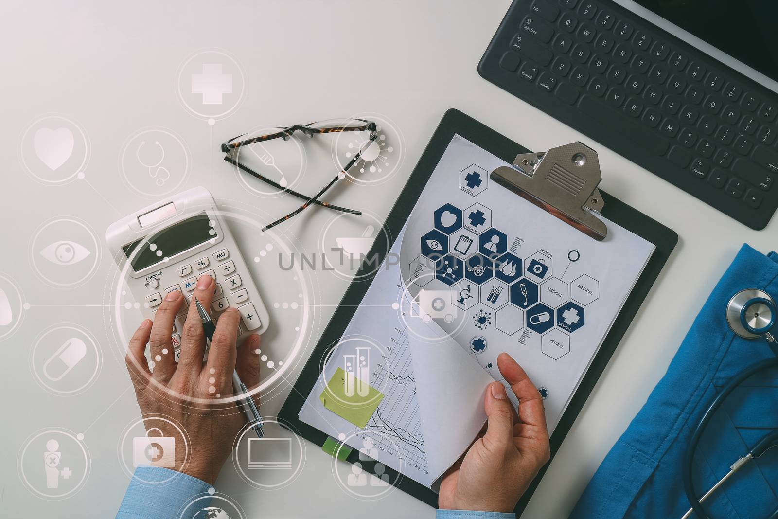 top view of Healthcare costs and fees concept.Hand of smart doctor used a calculator for medical costs in modern hospital with VR icon diagram