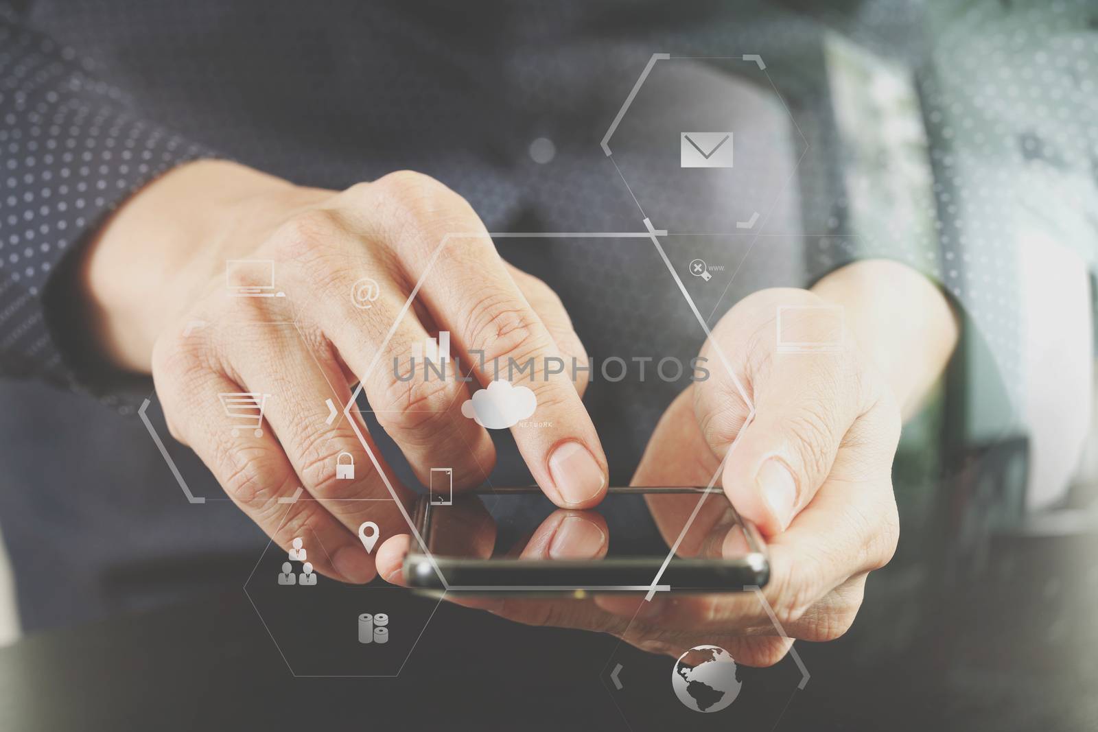 close up of businessman hand working with mobile phone in modern office with VR icon diagram