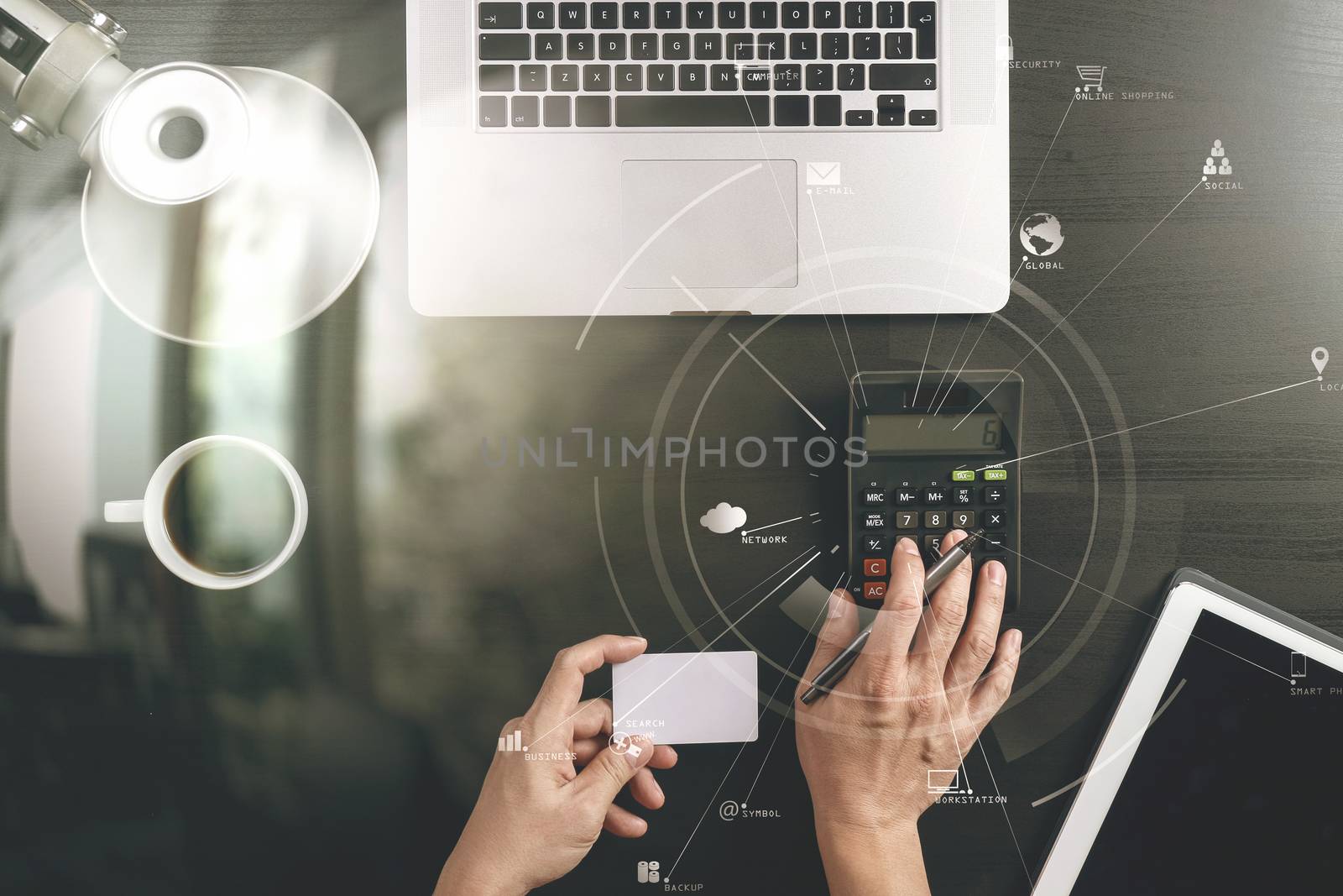 Internet shopping concept.Top view of hands working with calculator and laptop and credit card and tablet computer on dark wooden table background with Vr diagram