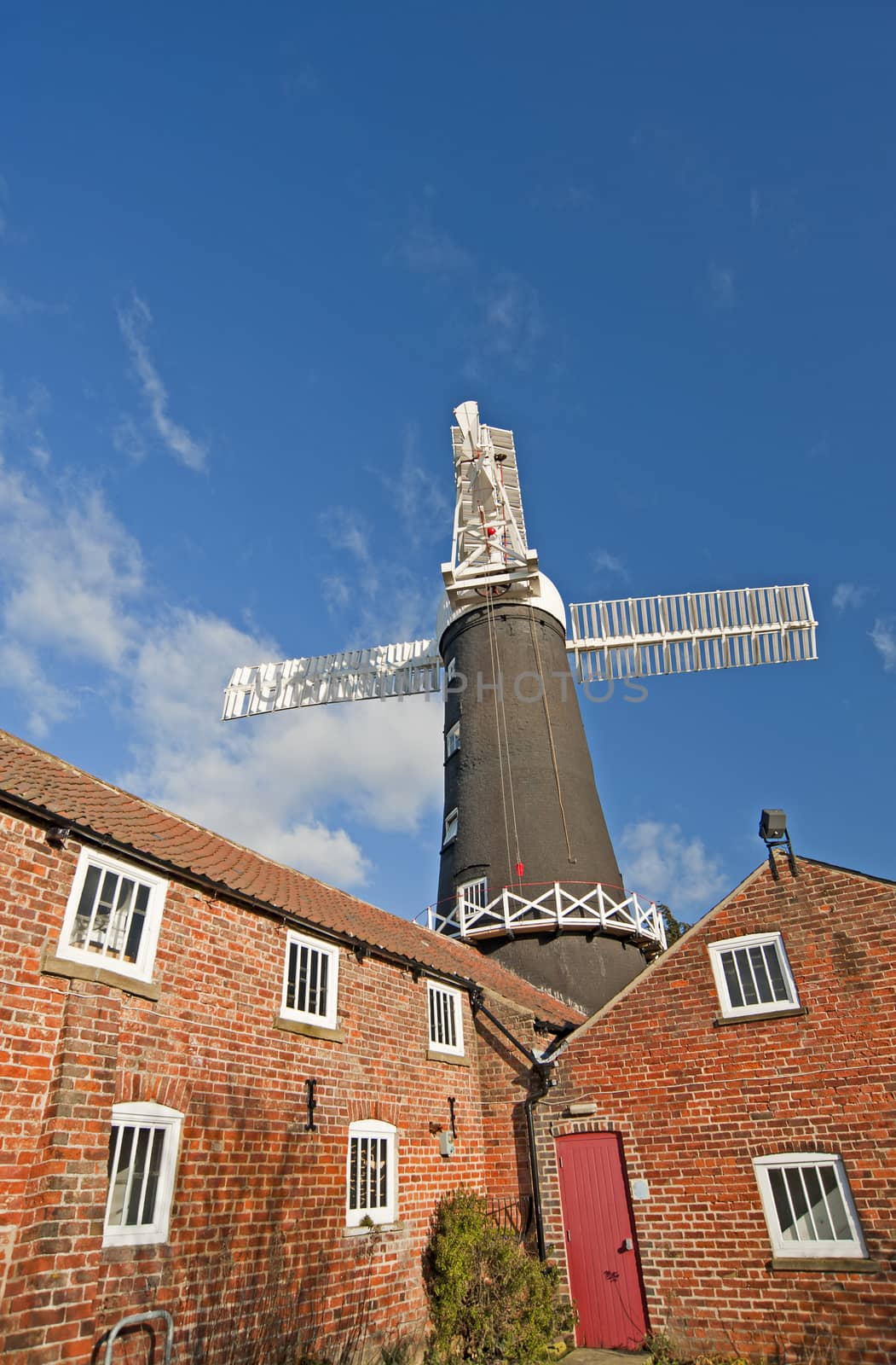 Traditional working windmill at a granary in the countryside
