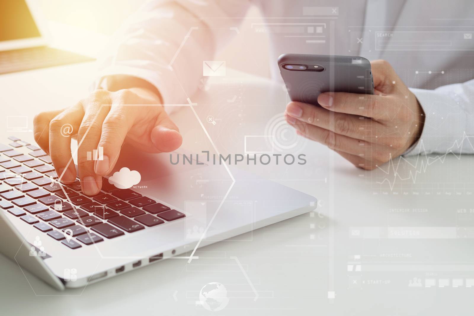 Big data analytics with business intelligence (BI) concept. businessman using mobile phone and laptop computer on white desk with VR chart and graph with icon 