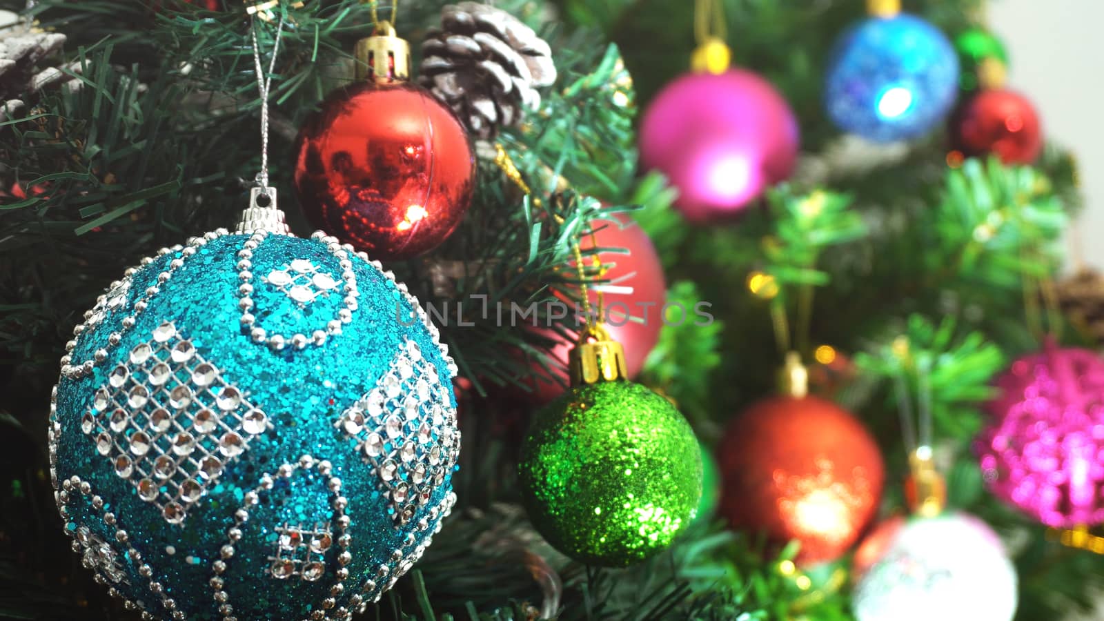 Greeting Season concept.close up of ornaments on a Christmas tre by everythingpossible