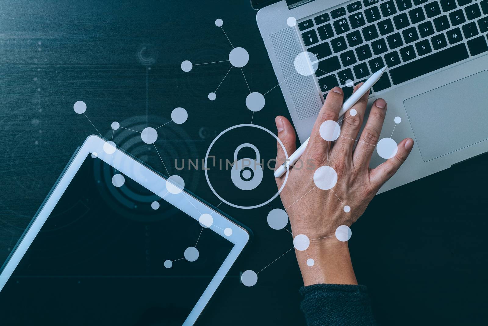 cyber security internet and networking concept.Businessman hand working with VR screen padlock icon on laptop and digital tablet computer