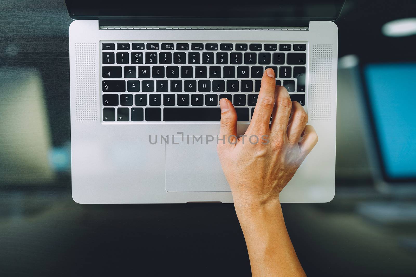 top view of businessman typing keyboard with laptop computer on  by everythingpossible