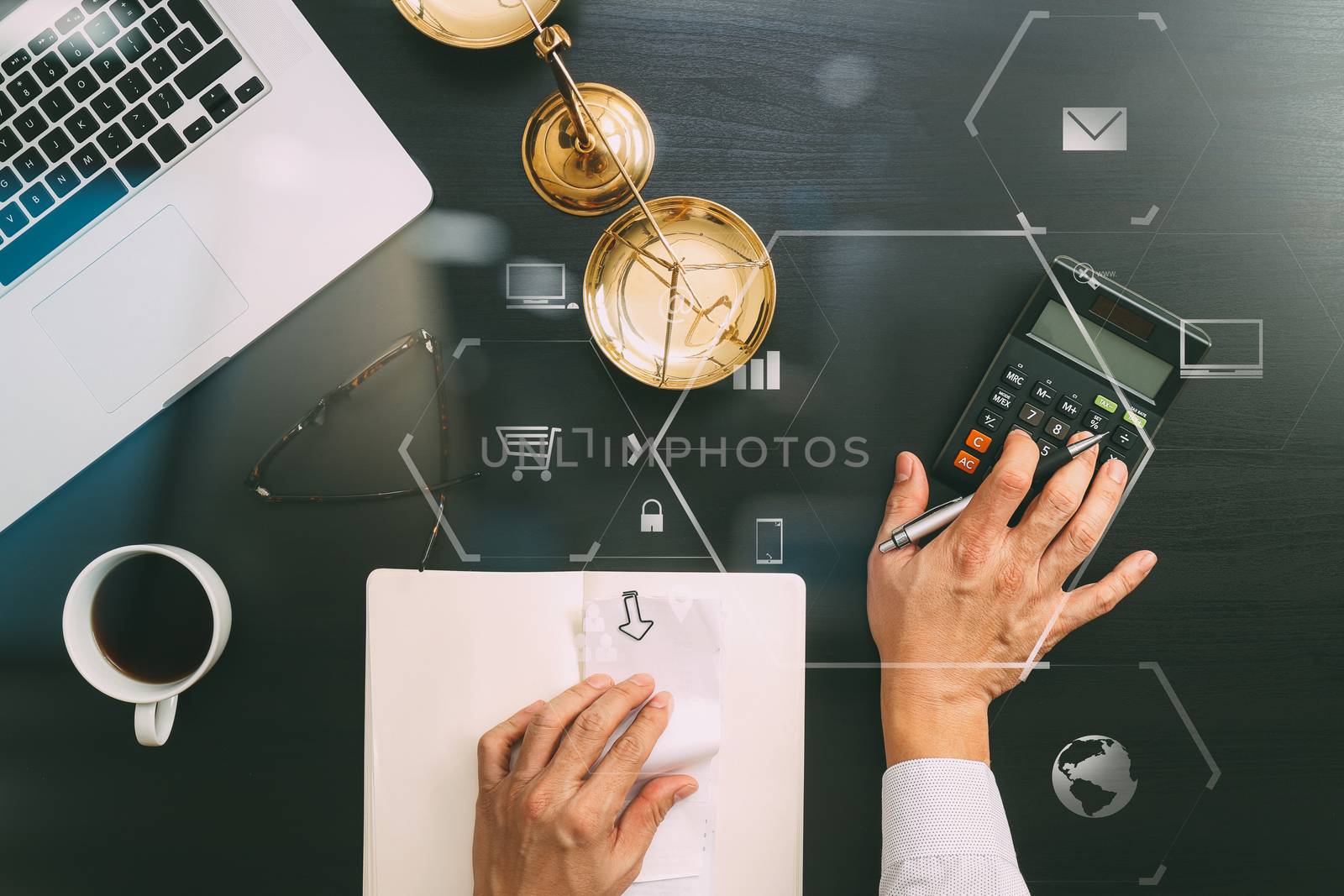 justice and law concept.businessman or lawyer or accountant working on accounts using a calculator and laptop computer and documents with Vr diagram