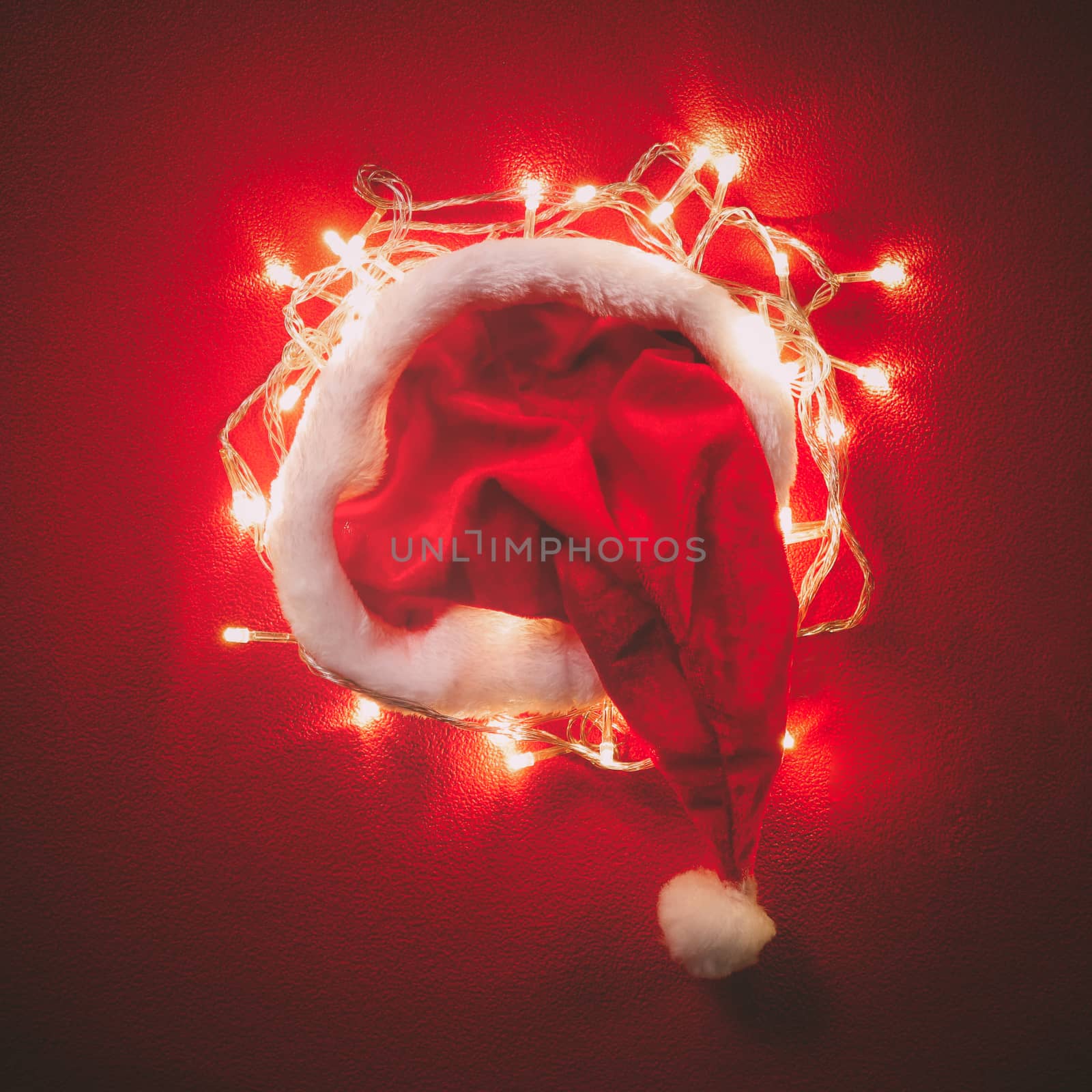 Greeting Season concept.Santa Claus hat with christmas light on  by everythingpossible