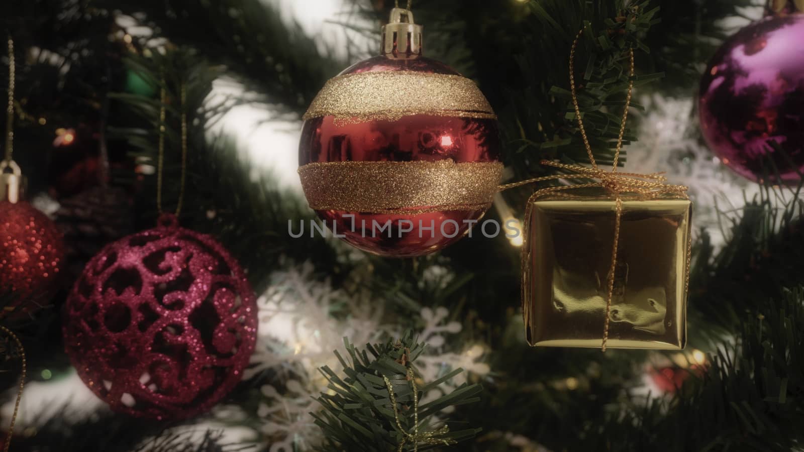 Greeting Season concept.close up of ornaments on a Christmas tree with decorative light