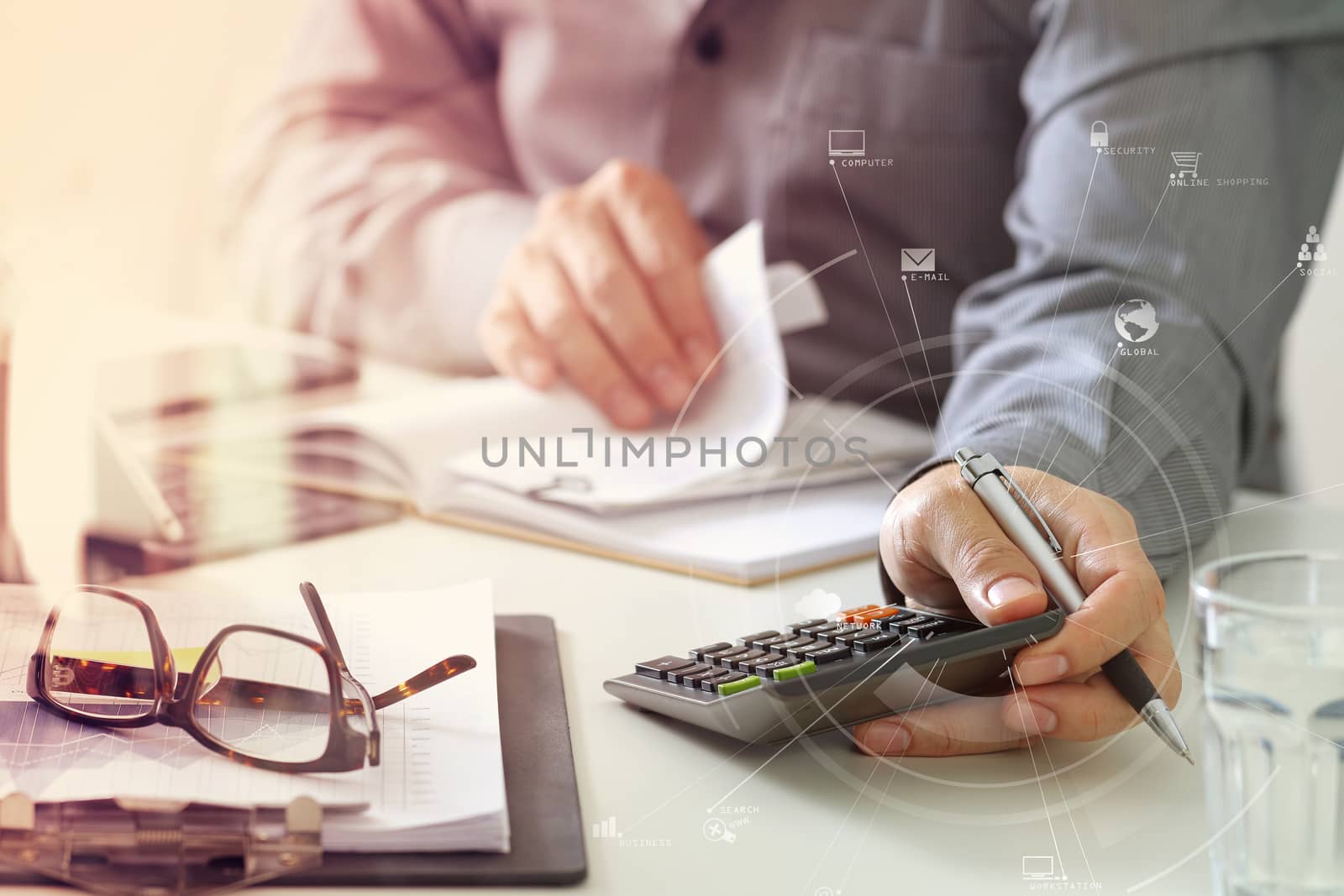 businessman hand working with finances about cost and calculator by everythingpossible