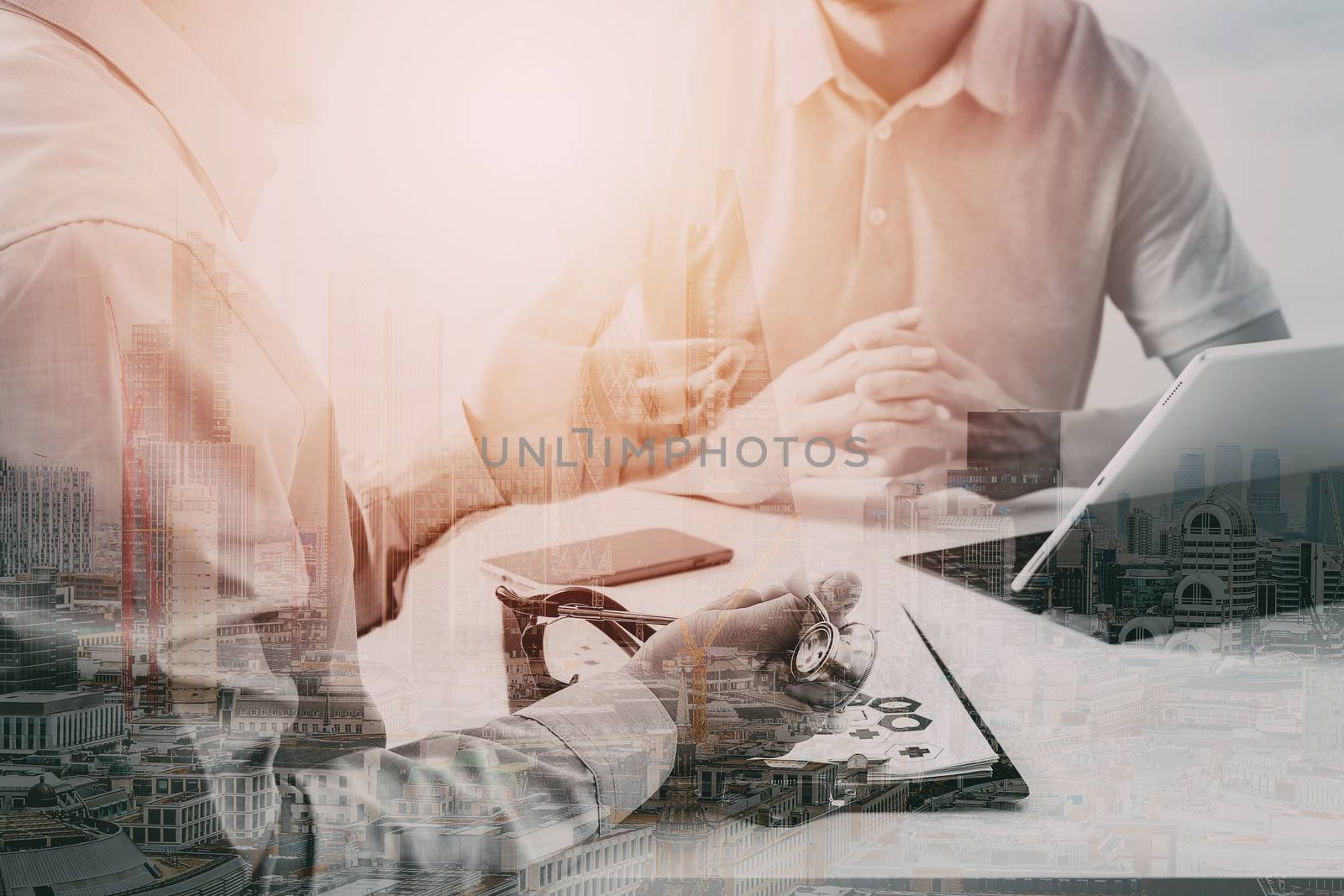 Medical doctor using mobile phone and consulting businessman patient having exam as Hospital professionalism concept with city exposure