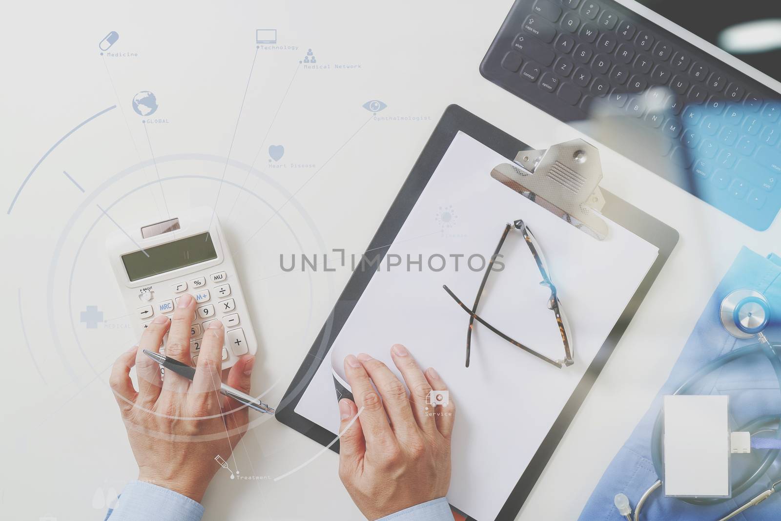 top view of Healthcare costs and fees concept.Hand of smart doctor used a calculator for medical costs in modern hospital with VR icon diagram