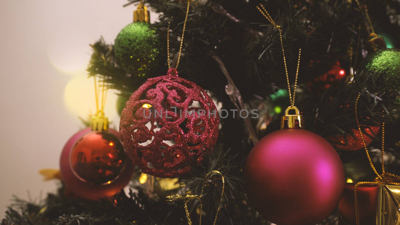 Greeting Season concept.close up of ornaments on a Christmas tree with decorative light