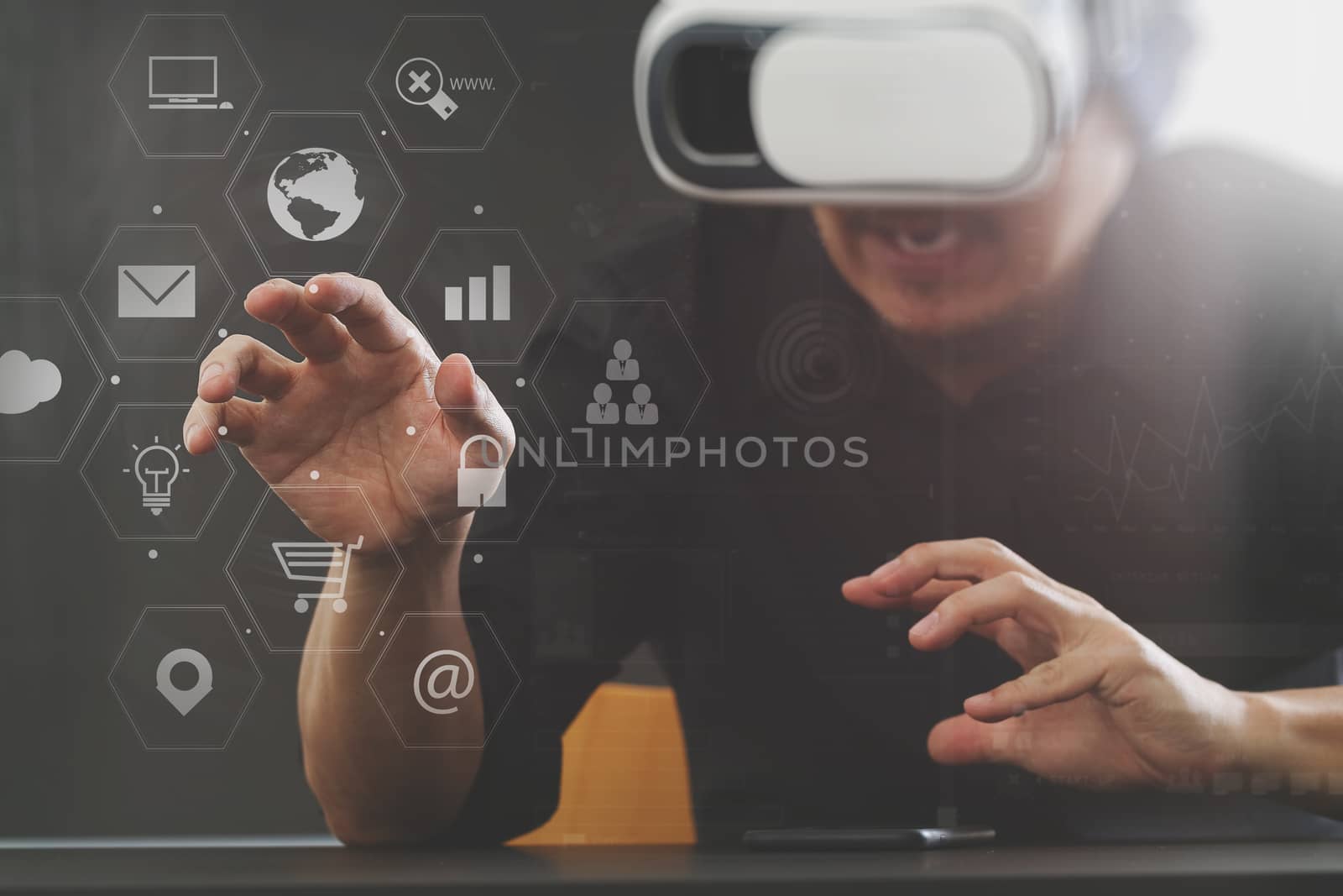 businessman wearing virtual reality goggles in modern office with Smartphone using with VR headset with screen icon diagram