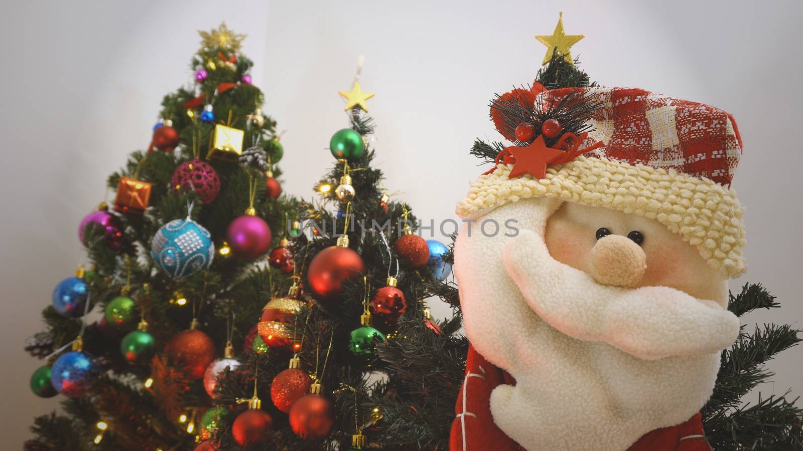 Greeting Season concept.close up of ornaments on a Christmas tree with decorative light