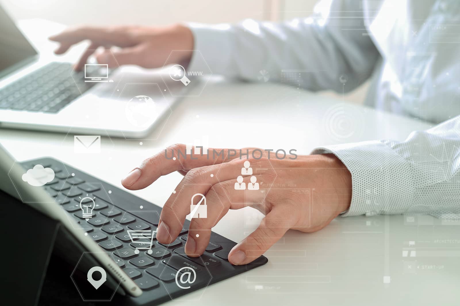 close up of businessman typing keyboard with laptop computer and by everythingpossible