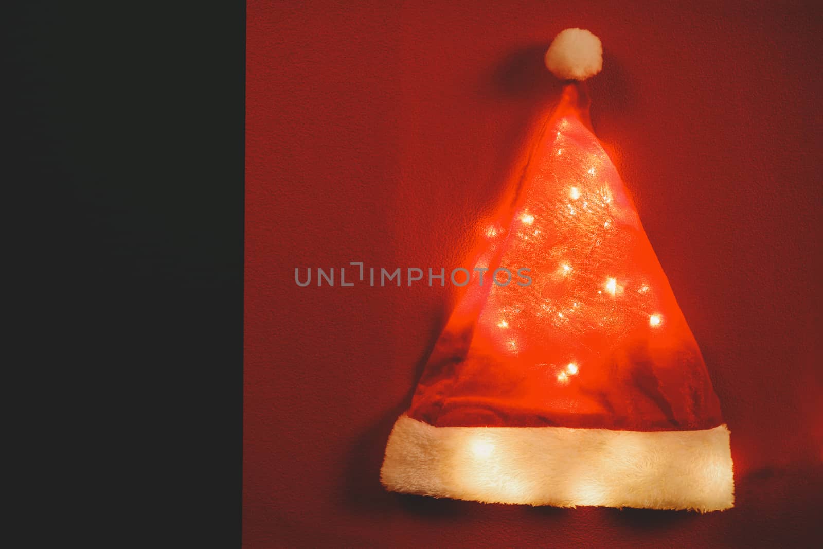 Greeting Season concept.Santa Claus hat with christmas light on  by everythingpossible