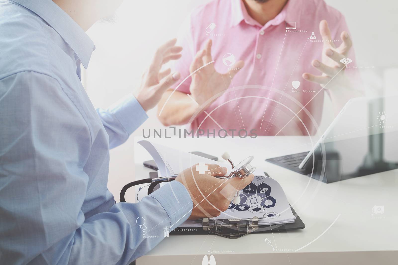 Medical doctor using mobile phone and consulting businessman pat by everythingpossible