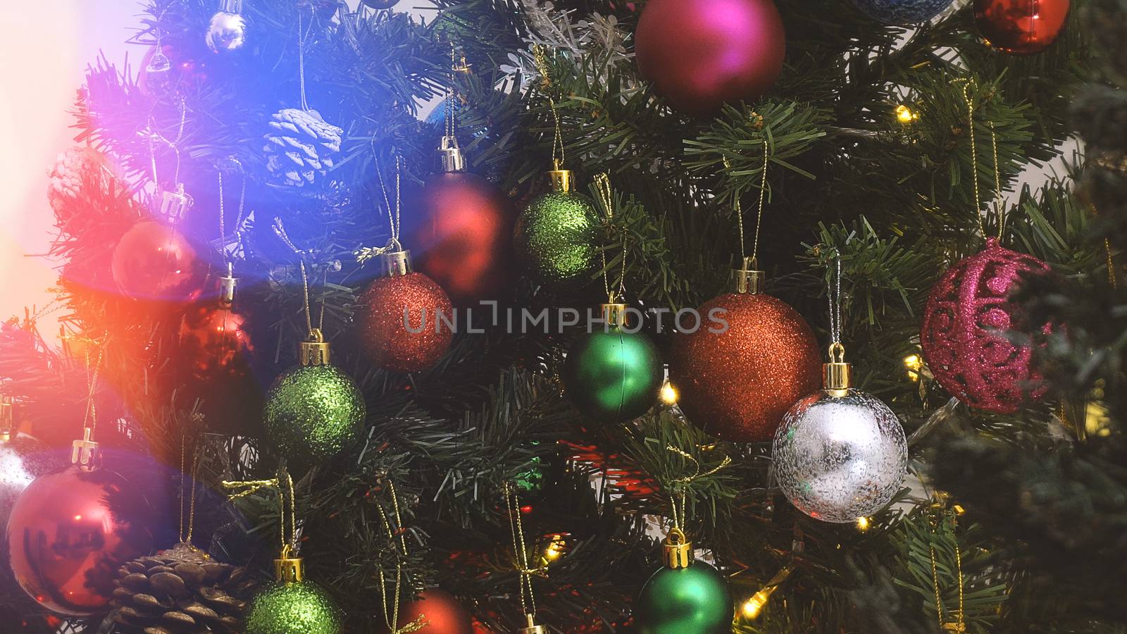 Greeting Season concept.close up of ornaments on a Christmas tree with decorative light