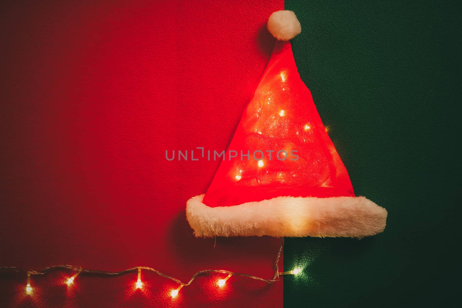 Greeting Season concept.Santa Claus hat with christmas light on  by everythingpossible