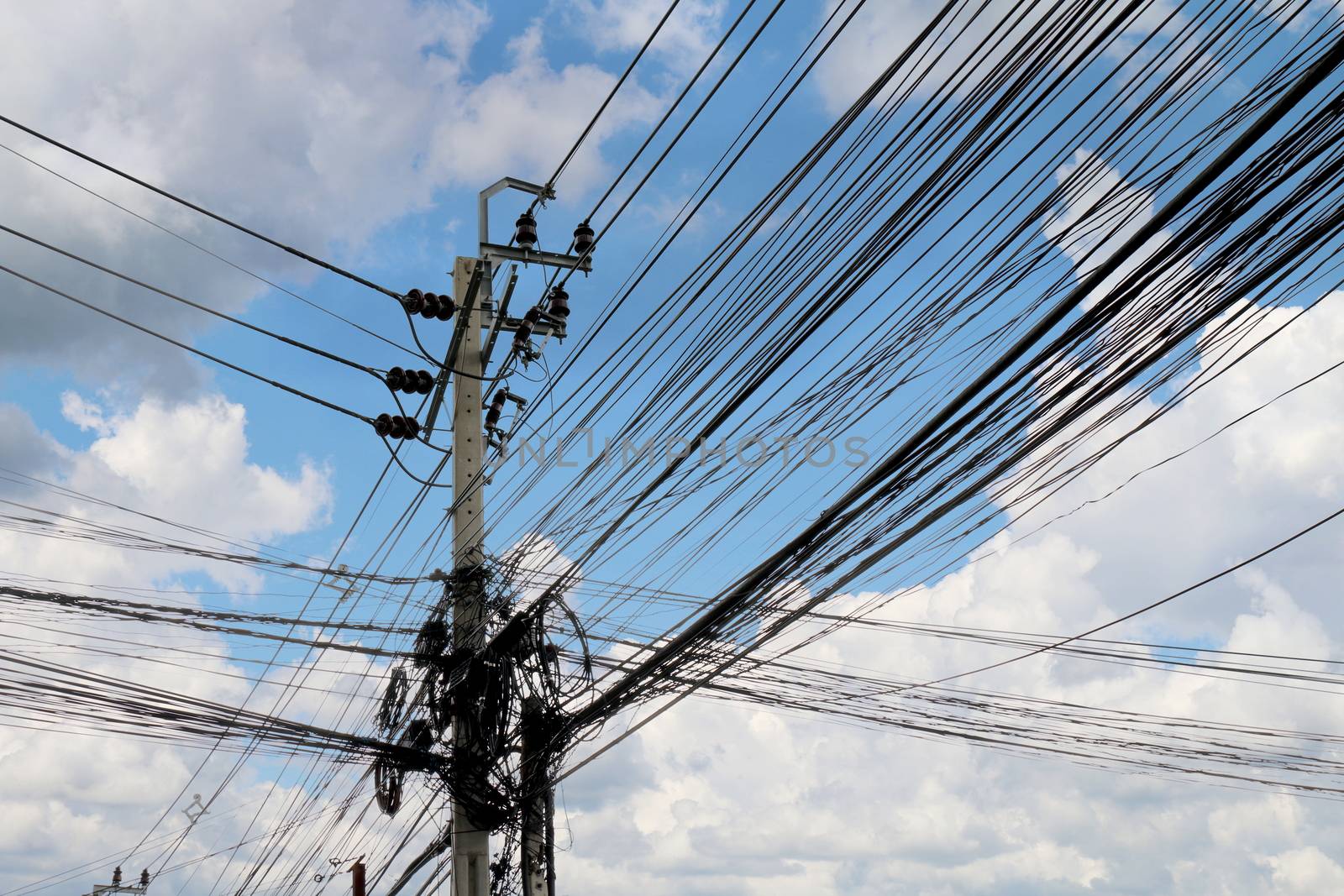 Tangle wire on road, wire in Thailand electrical energy at walking streets side sky background