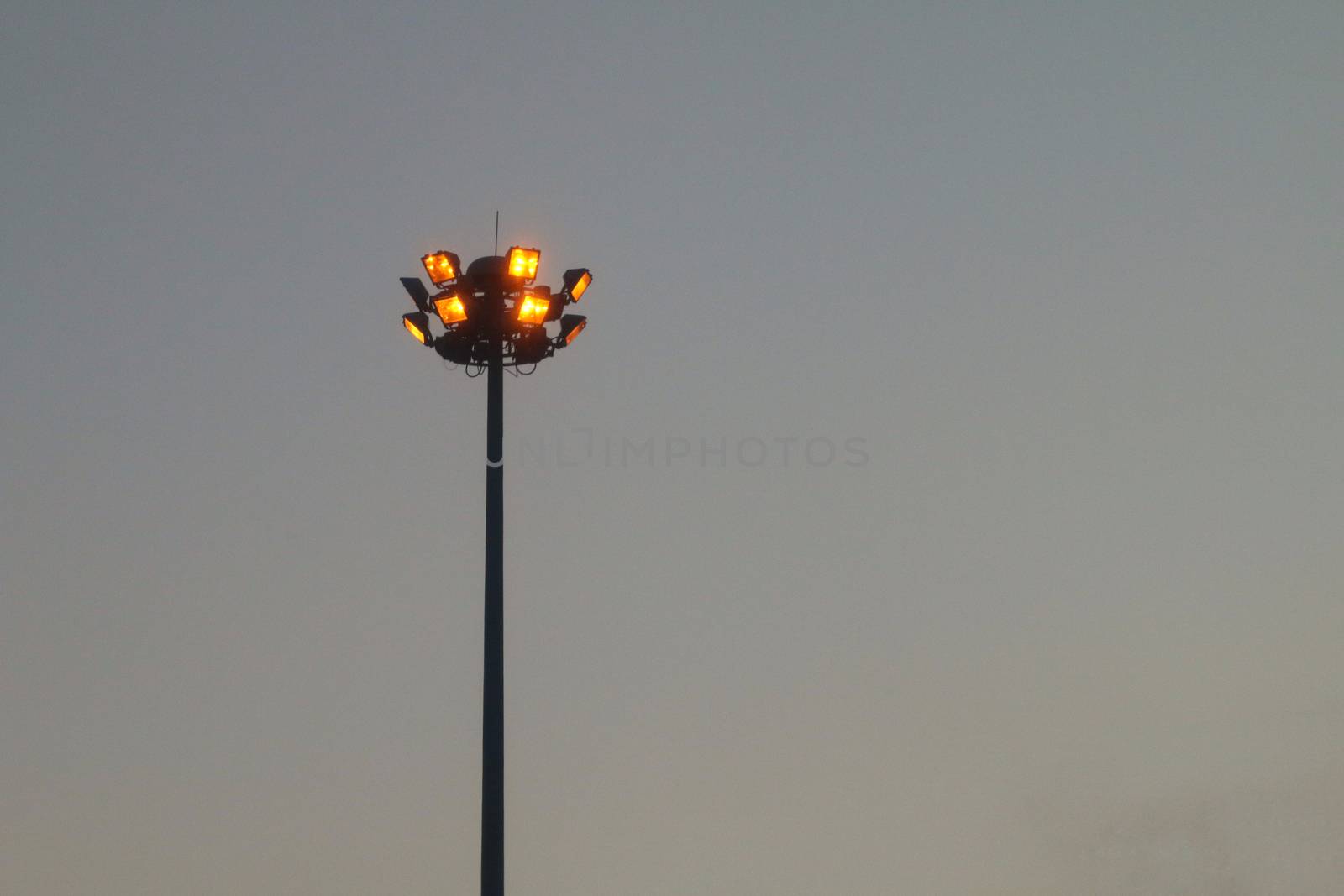 Light orange pole big on the highway, superhighway lighting column at night. by cgdeaw