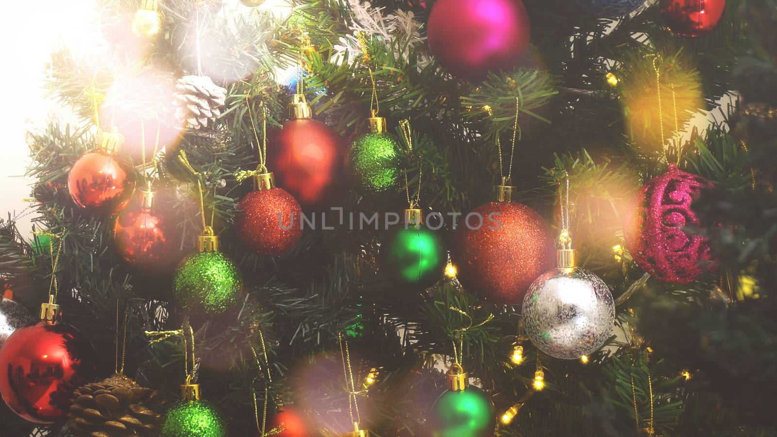 Greeting Season concept.close up of ornaments on a Christmas tree with decorative light