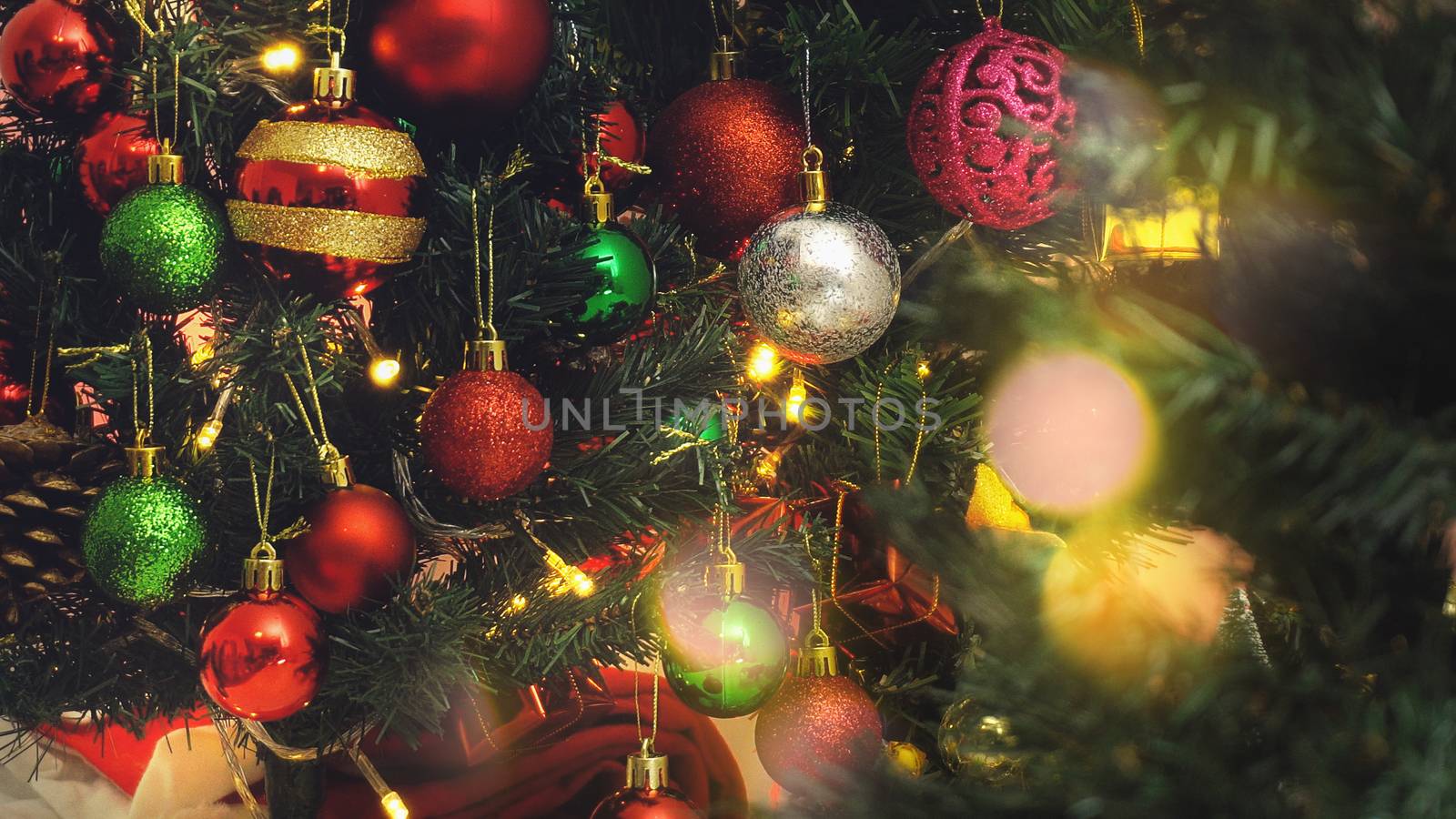 Greeting Season concept.close up of ornaments on a Christmas tre by everythingpossible