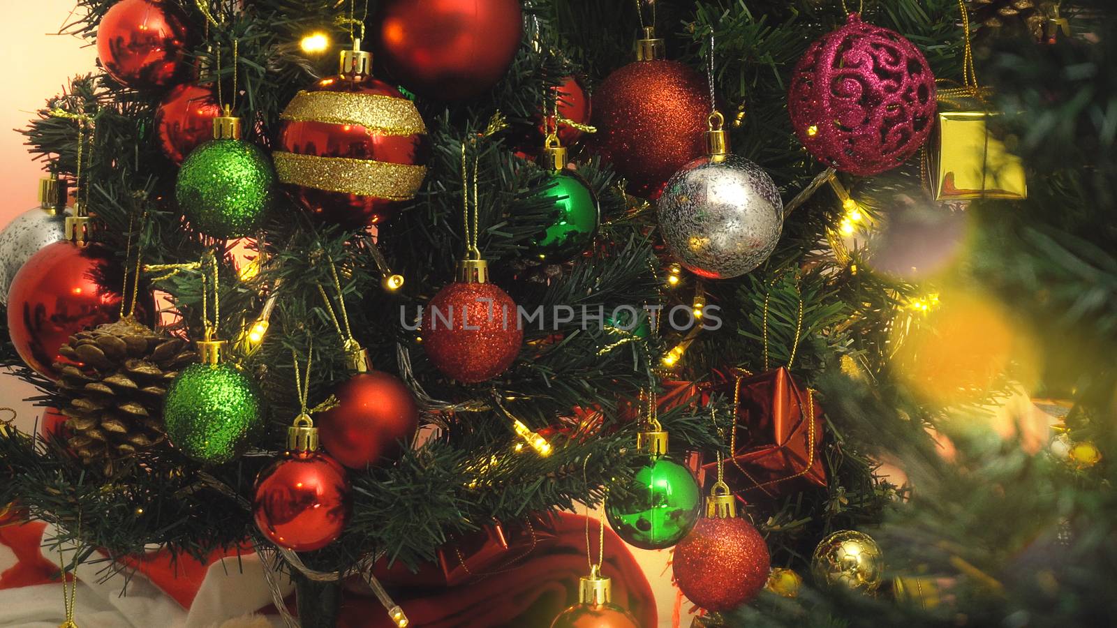 Greeting Season concept.close up of ornaments on a Christmas tre by everythingpossible