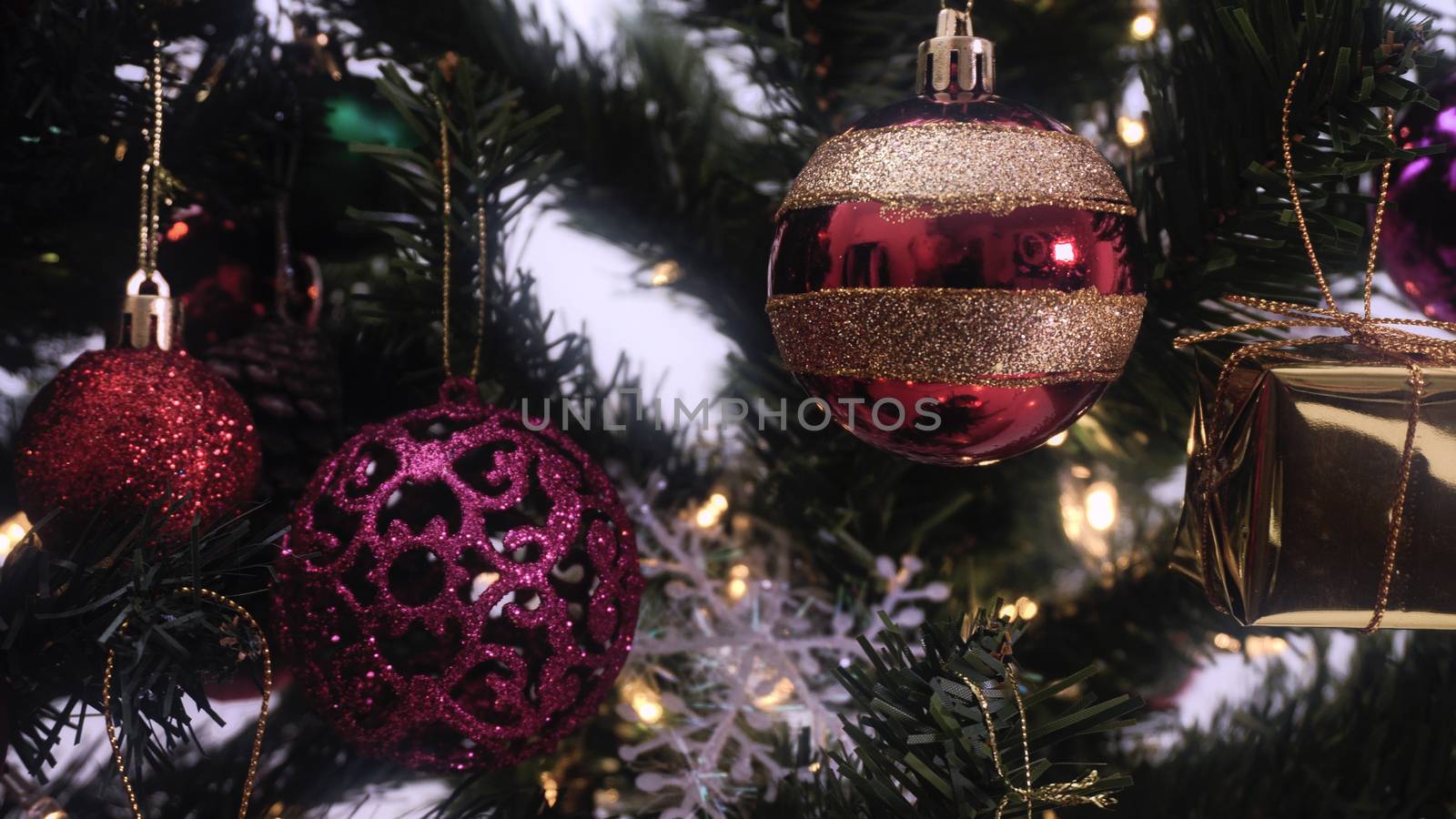 Greeting Season concept.close up of ornaments on a Christmas tree with decorative light
