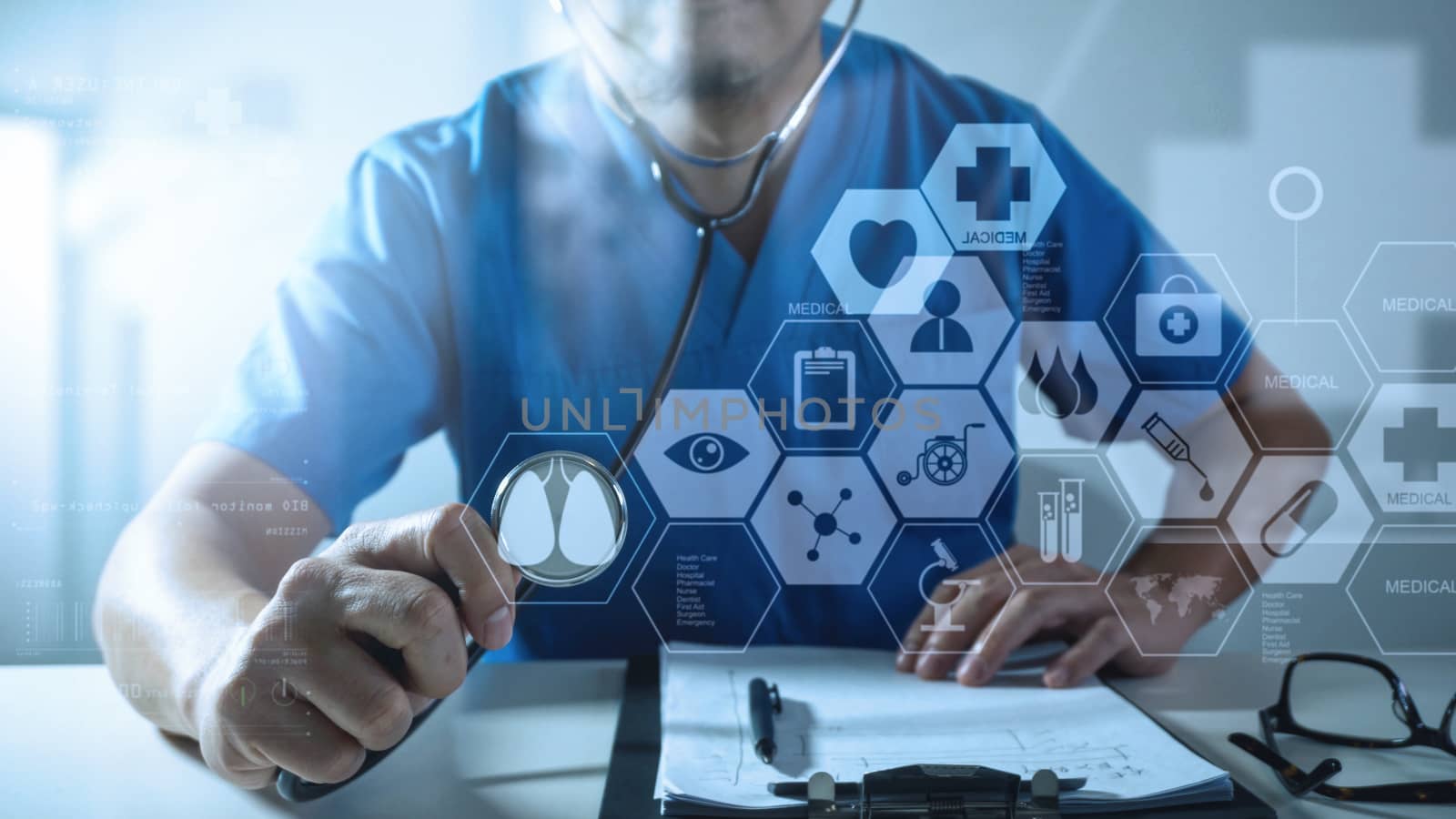 Medical techonlogy concept,smart doctor hand working with modern computer in hospital office with virtual icon diagram