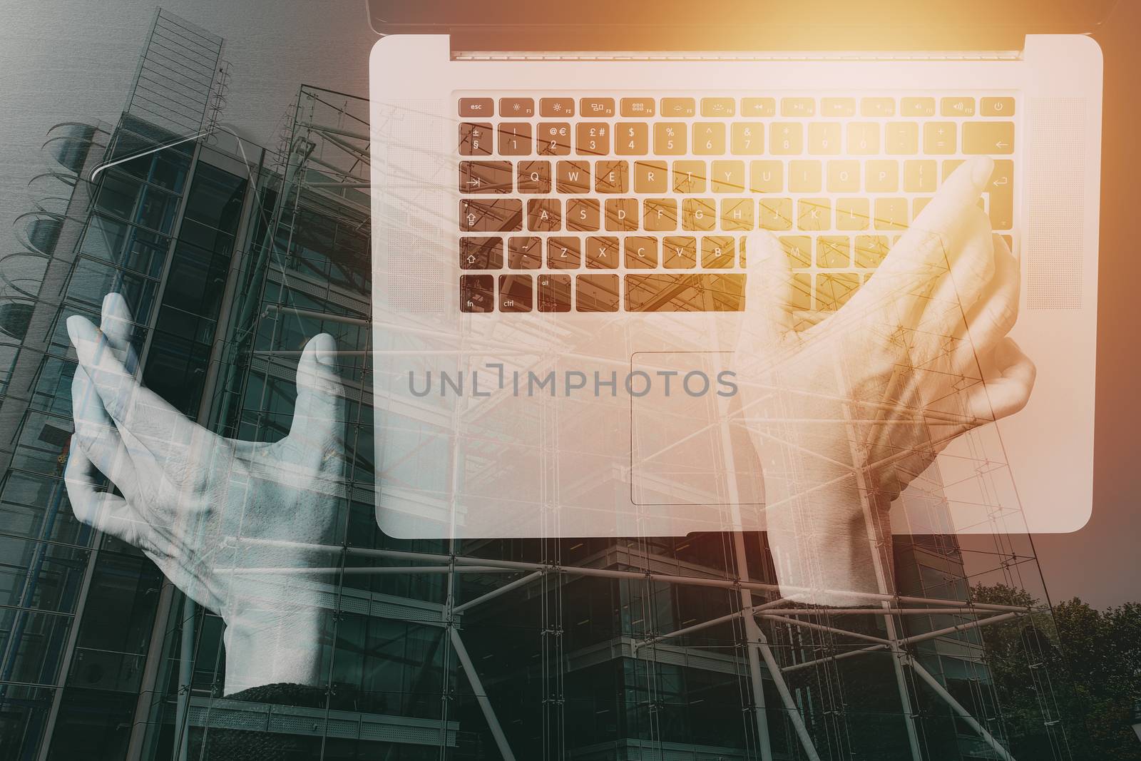 cyber security internet and networking concept.Businessman hand working with VR screen padlock icon mobile phone on laptop computer background with buildings exposure